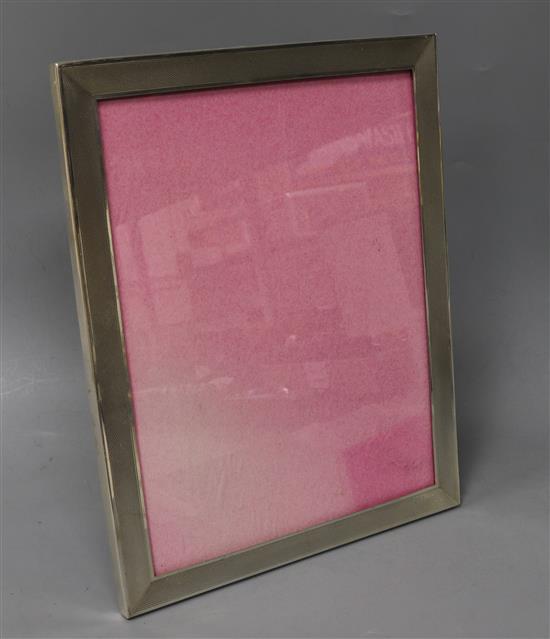 A 1960s engine turned silver rectangular photograph frame, 25.6cm.